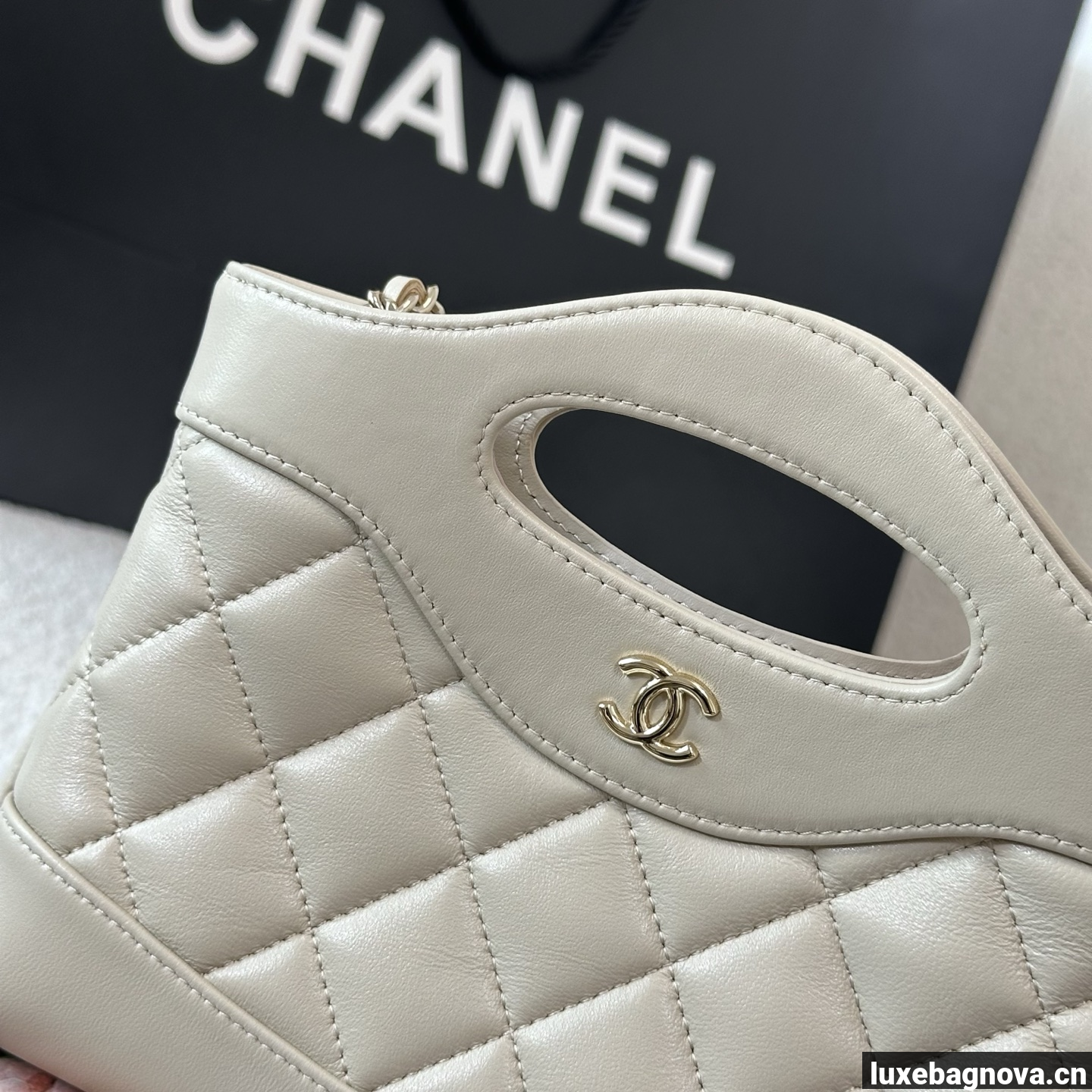 Chanel Beige quilted leather mini tote bag with chain shoulder strap