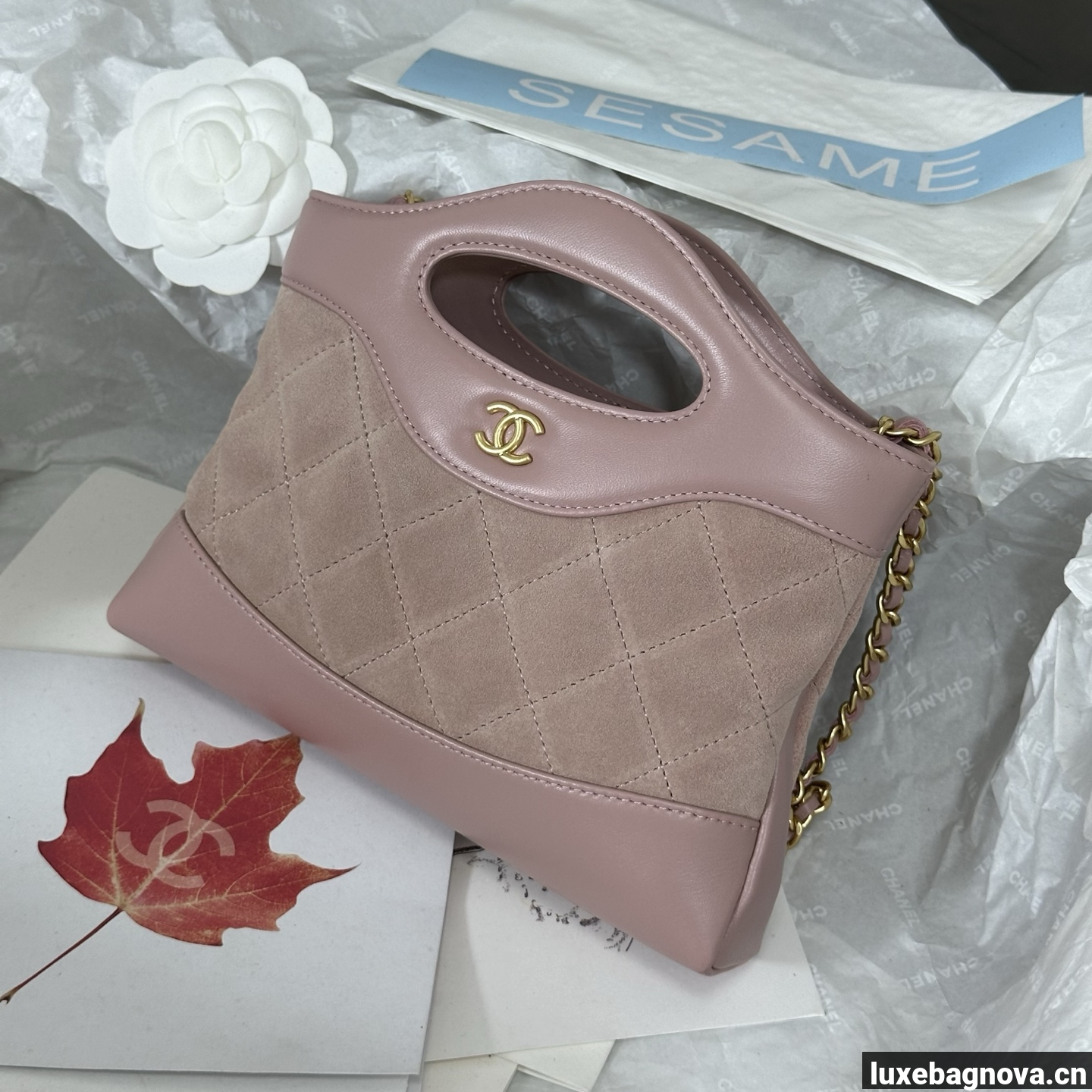 Chanel Light Pink quilted leather mini tote bag with chain shoulder strap