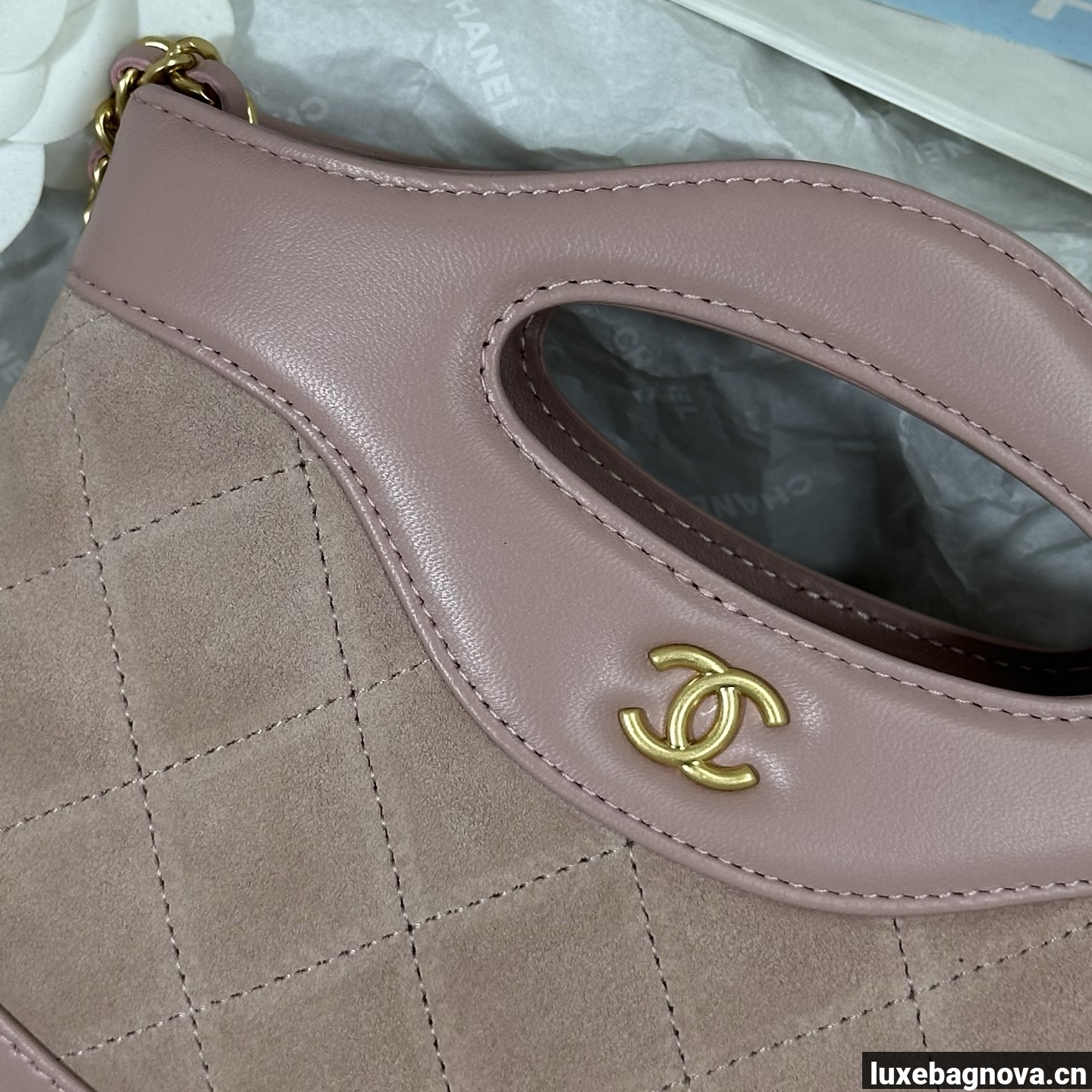 Chanel Light Pink quilted leather mini tote bag with chain shoulder strap