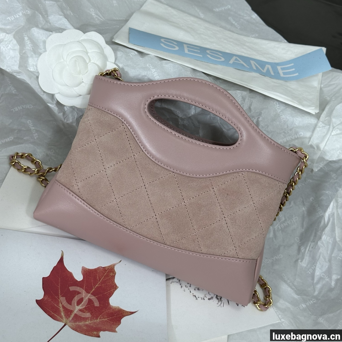 Chanel Light Pink quilted leather mini tote bag with chain shoulder strap