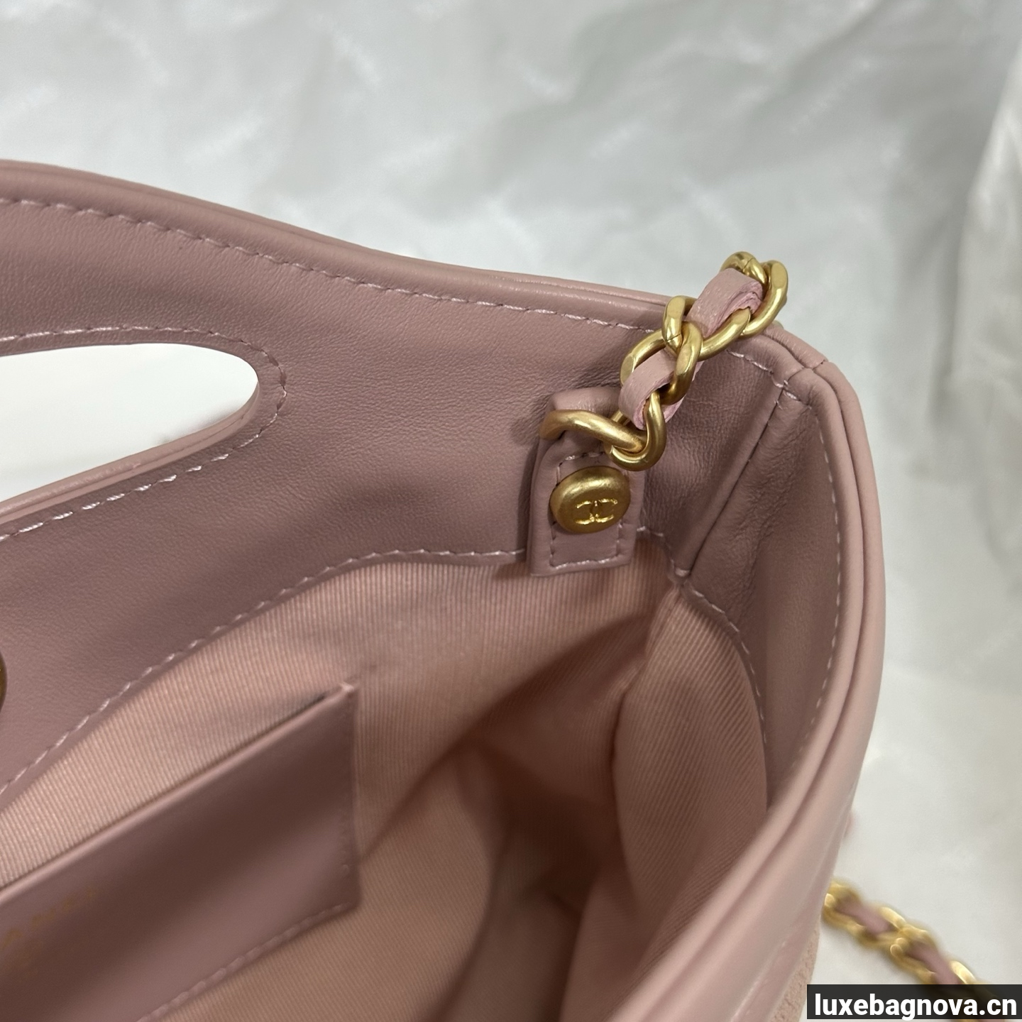 Chanel Light Pink quilted leather mini tote bag with chain shoulder strap